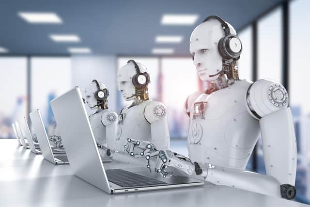 AI Copywriting depicted by AI robots sitting at computers